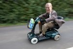 Prince Philip on a mobility scooter.jpg