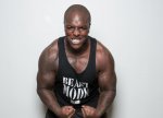 adebayo-akinfenwa-showing-off-his-muscles-and-strength.jpg